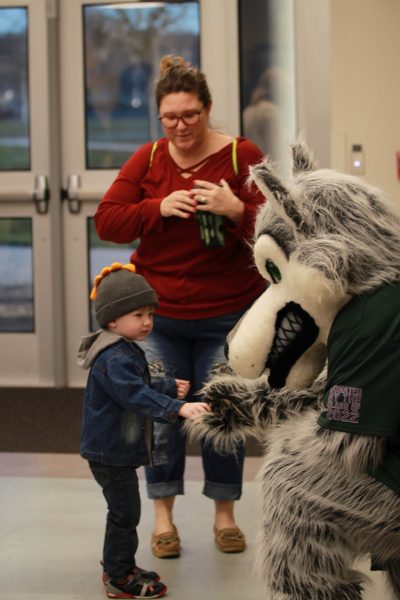 Carmine the Coyote greeting the families of the students that worked hard to be at Howlabration. 

 