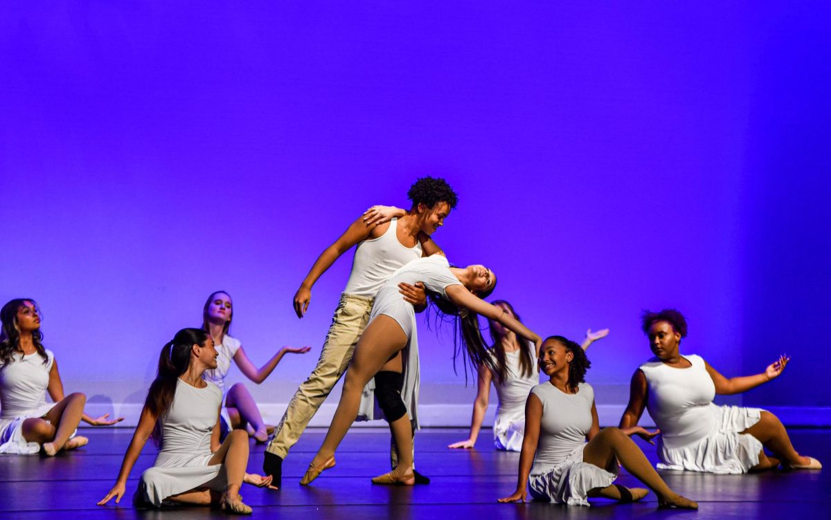 The+blue+hue+creates+a+winter+compliment+as+the+CCHS+dancers+express+themselves+during+the+winter+showcase+at+the+IPAC.