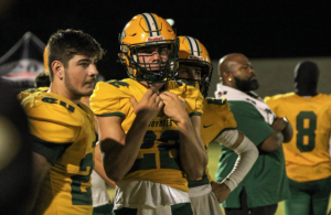 Cooling with the creek! Senior Chase Cholnik and Sophomore Roy Ambler are having agood time watching the defense making stops. Even after losing the game, they still had faith in their defense for the next game. Sophomore Roy Ambler Said, really thought we had it until the end of the game until they had more than us.”    