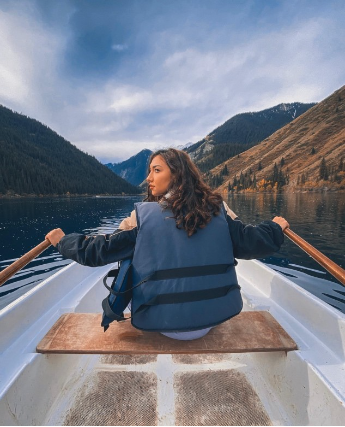 Takhmina Almazbekova is on a boat on Lake Kolsay. The lake is surrounded by high mountains which makes Lake Kolsay a favourite place for mountain tourists. 