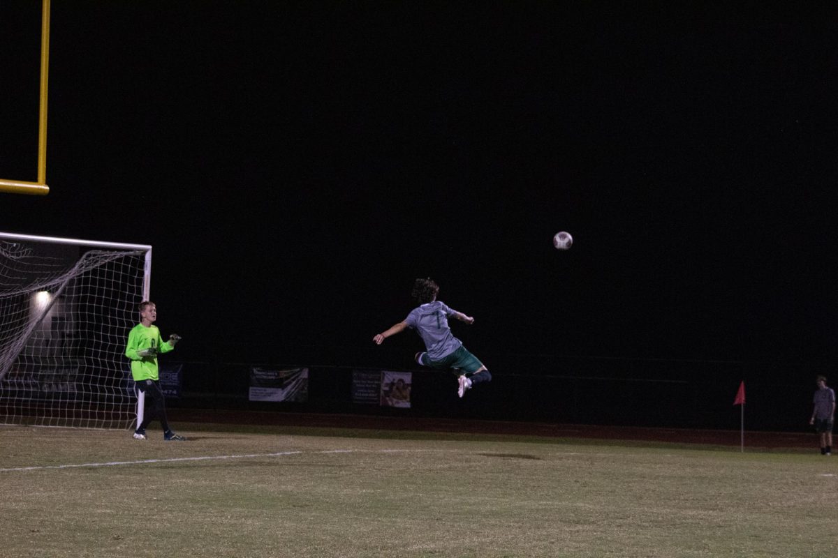 BICYCLE KICK. Sophomore Thomas Garcia is warming up to play Anclote trying to hit his signature goal called a bicycle kick. When Cypress Creek started the game against Anclote Garcia finally got the opportunity to hit the bicycle kick and he goes up for but barely misses wide because the amount of skill it takes to hit a bicycle is unimaginable. “I am a little disappointed that I was not able to score the bicycle, but I am not mad because I know it is one of the hardest skills to do in soccer,” said sophomore Tomas Garcia.