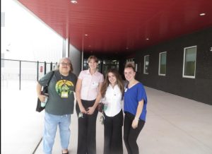 Passing the torch! FBLA sponsor Mrs. Karen Lang, junior Rowan Maggy, senior Hannah Rizzo, and junior Ainsley Wilgis travel to Kirkland Ranch K-8 to educate middle schoolers on joining FBLA. "I love being included in a community of motivated students who share similar goals of learning and having successful futures and careers," said Maggy. (FBLA)