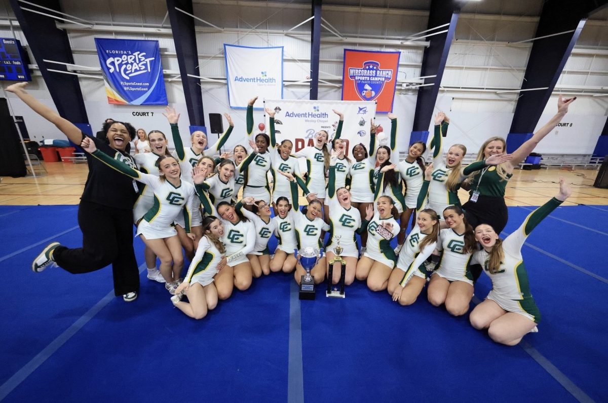 The Cypress Creek cheer team took a picture with their 1st place award and their grand champion award that they received from the “best of Pasco” competition at the Wiregrass Sports Complex on December 5, 2025. 
